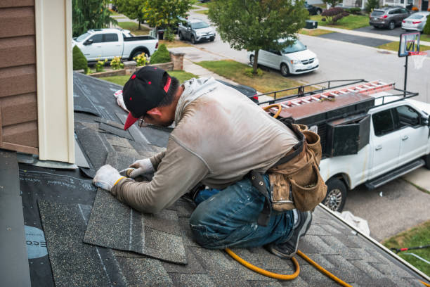 Professional Storm Damage Roof Repair technician working in Green Cove Springs, FL